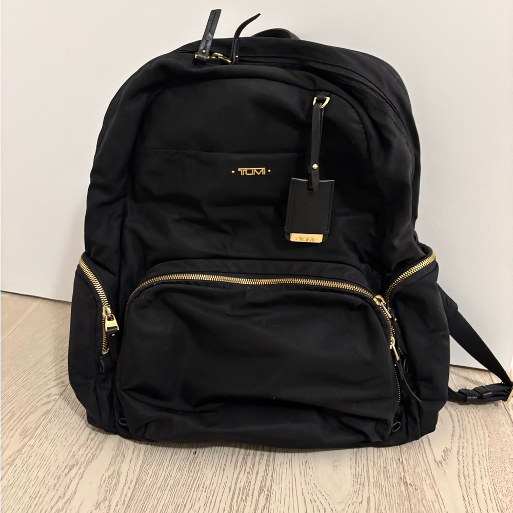 Tumi Black Backpack with Gold Accents